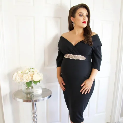 IMG_0783 Elegant black maternity gown available for hire, styled for a photoshoot.