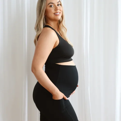 Tezza-3984 Model wearing black seamless maternity shorts with high waistband.